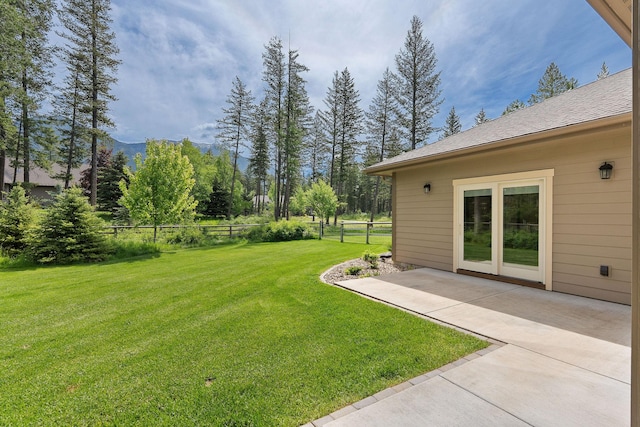 74 Wood Ridge Dr, Columbia Falls, MT 59912 - view of yard with a patio and a mountain view