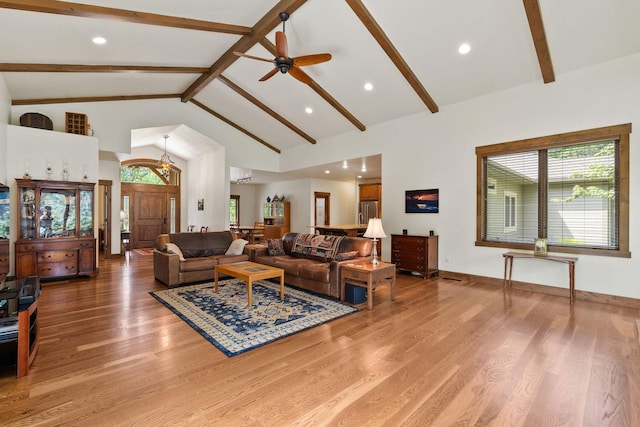 74 Wood Ridge Dr, Columbia Falls, MT 59912 - living area featuring beam ceiling, a ceiling fan, wood finished floors, high vaulted ceiling, and recessed lighting