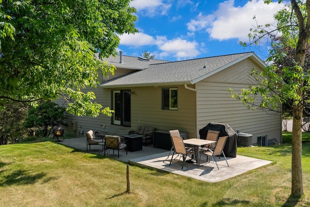 4750 Mark Ct, Missoula, MT 59803 - back of house with a patio, a shingled roof, a yard, and cooling unit