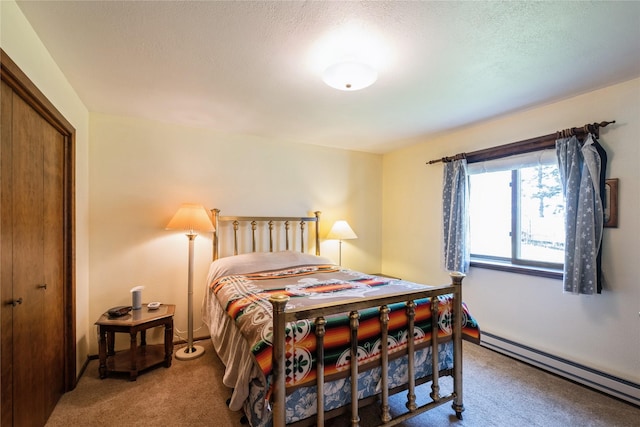 965 Ranch Ln, Kalispell, MT 59901 - bedroom with a baseboard radiator, carpet, and a closet