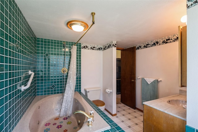965 Ranch Ln, Kalispell, MT 59901 - bathroom featuring vanity, a combined bath / shower with jetted tub, and tile patterned floors