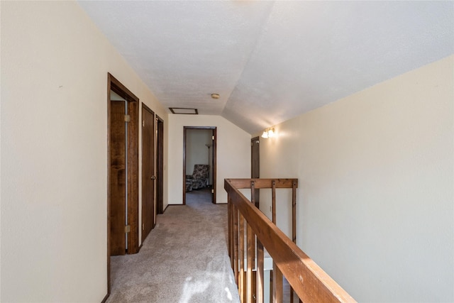 965 Ranch Ln, Kalispell, MT 59901 - hall featuring an upstairs landing, light colored carpet, and lofted ceiling