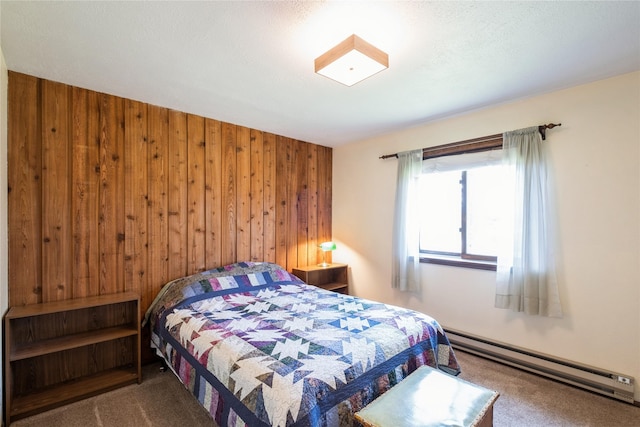 965 Ranch Ln, Kalispell, MT 59901 - bedroom featuring a baseboard heating unit, carpet flooring, and wood walls