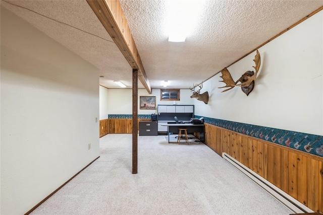 965 Ranch Ln, Kalispell, MT 59901 - finished below grade area with baseboard heating, a textured ceiling, a wainscoted wall, an office area, and light carpet