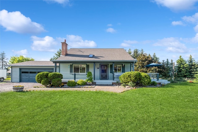 965 Ranch Ln, Kalispell, MT 59901 - view of front of home with a porch, a chimney, a front lawn, a garage, and driveway
