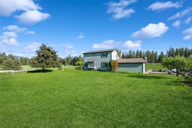 965 Ranch Ln, Kalispell, MT 59901 - rear view of property featuring a yard and a chimney