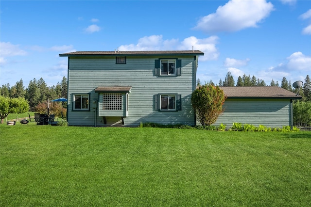 965 Ranch Ln, Kalispell, MT 59901 - back of house featuring a yard
