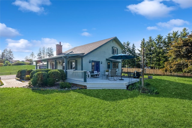 965 Ranch Ln, Kalispell, MT 59901 - rear view of property featuring a chimney and a deck