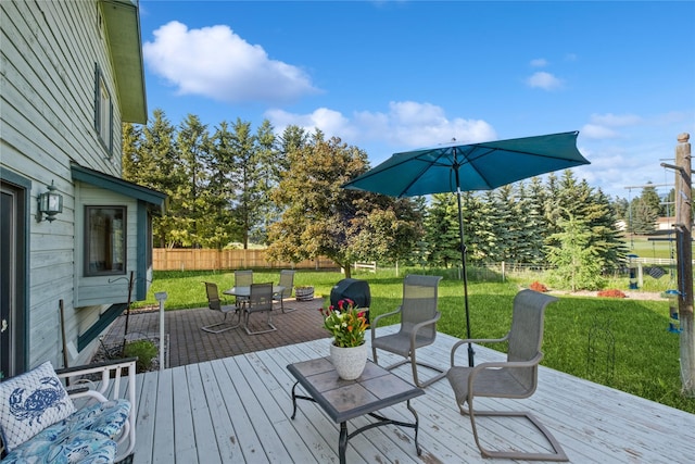 965 Ranch Ln, Kalispell, MT 59901 - wooden terrace featuring outdoor dining space and a fenced backyard