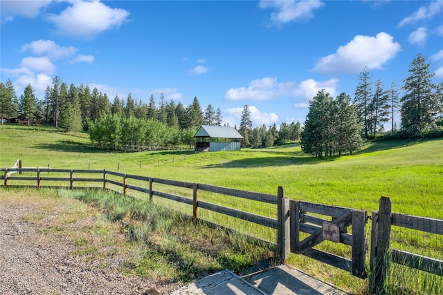 965 Ranch Ln, Kalispell, MT 59901 - view of yard featuring a rural view and an outbuilding
