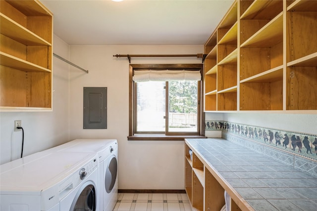 965 Ranch Ln, Kalispell, MT 59901 - laundry room with electric panel, washing machine and dryer, and light flooring
