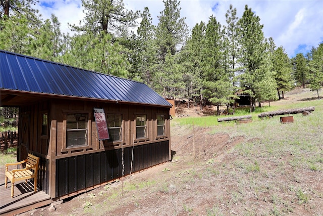 208 Paul Creek Ln, Cascade, MT 59421 - view of yard with an outdoor structure and view of wooded area