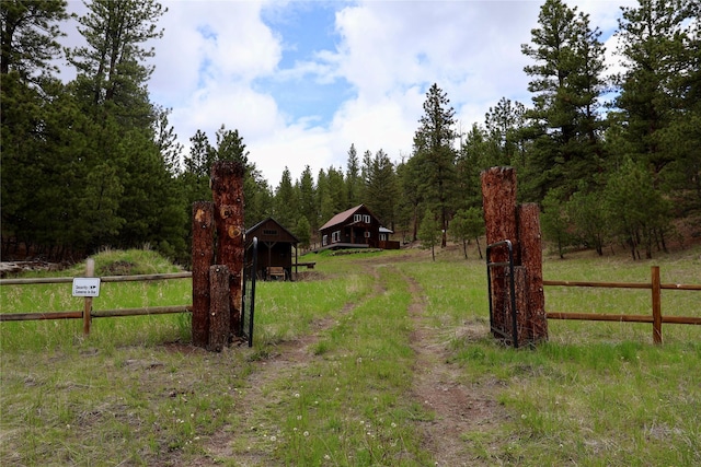 208 Paul Creek Ln, Cascade, MT 59421 - view of yard featuring an outbuilding and a forest view