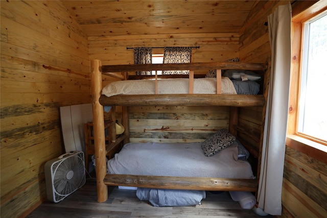 208 Paul Creek Ln, Cascade, MT 59421 - unfurnished bedroom with vaulted ceiling, multiple windows, wooden walls, wood finished floors, and wood ceiling