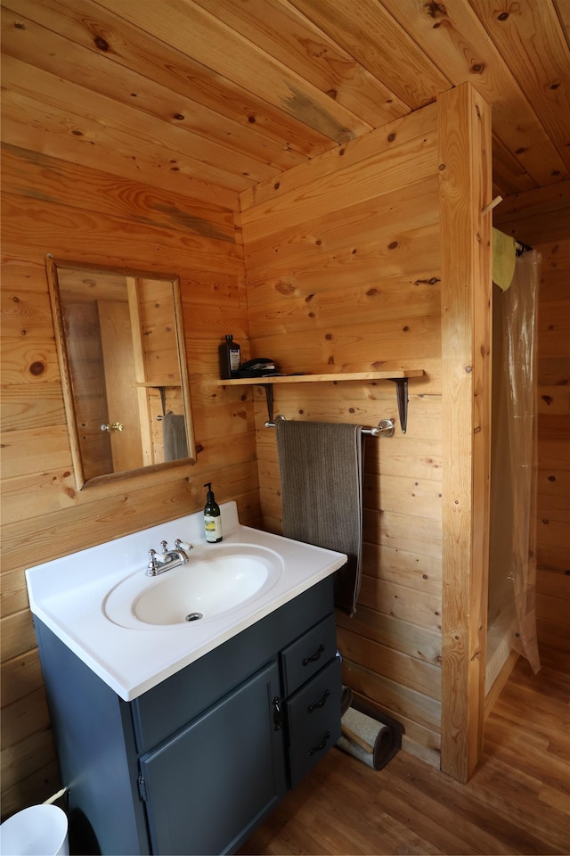 208 Paul Creek Ln, Cascade, MT 59421 - full bathroom with vanity, wood finished floors, a shower with shower curtain, wooden walls, and wood ceiling