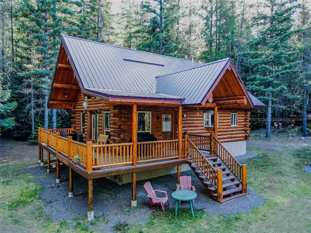 29 Northshore Dr, Troy, MT 59935 - back of house featuring log exterior, a deck, metal roof, and stairway