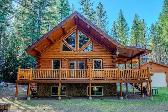 29 Northshore Dr, Troy, MT 59935 - rear view of house with a wooden deck, log exterior, stairs, and an outbuilding