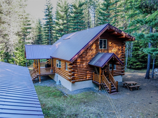 29 Northshore Dr, Troy, MT 59935 - view of front of property featuring log siding, stairway, and metal roof