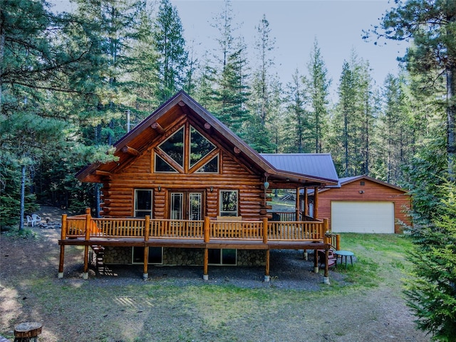 29 Northshore Dr, Troy, MT 59935 - view of front of property with a deck, an outdoor structure, log siding, and a wooded view
