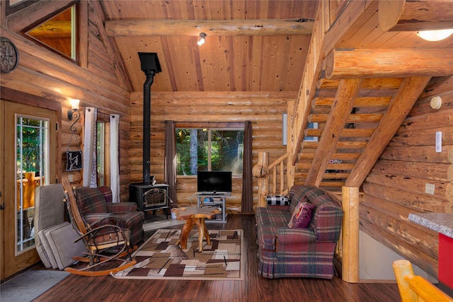 29 Northshore Dr, Troy, MT 59935 - living room with a wood stove, rustic walls, healthy amount of natural light, wooden ceiling with exposed beams, and wood finished floors