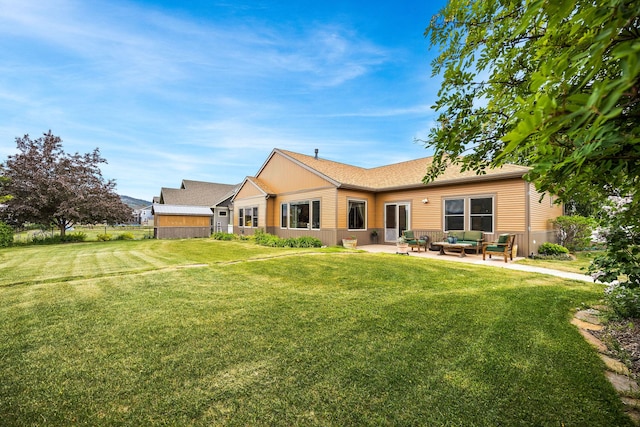 1399 Mackinaw Loop, Somers, MT 59932 - view of front of house with an outdoor living space, a patio area, and roof with shingles