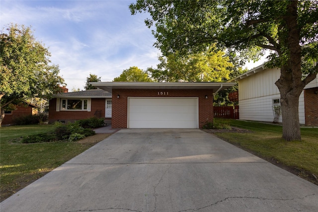 1511 E Broadway St, Helena, MT 59601 - single story home featuring brick siding, a front lawn, a garage, and driveway