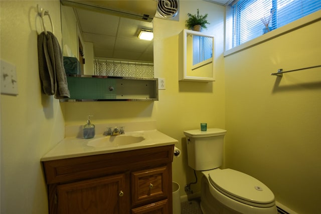 1511 E Broadway St, Helena, MT 59601 - full bath featuring a baseboard heating unit, vanity, toilet, curtained shower, and a paneled ceiling