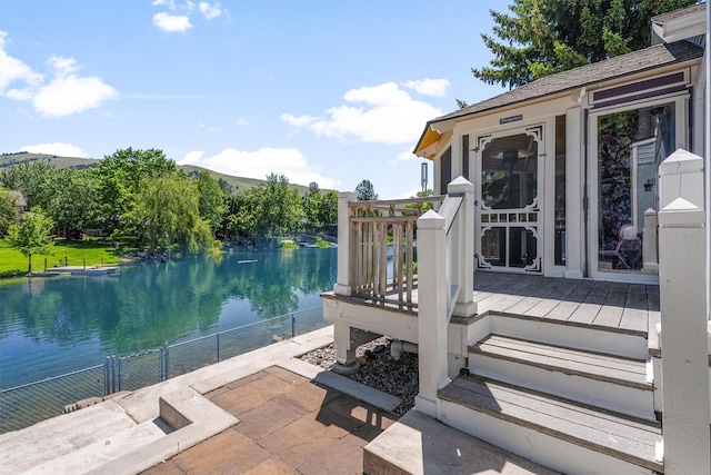 238 Red Fox Rd, Lolo, MT 59847 - view of patio / terrace with a deck with water view