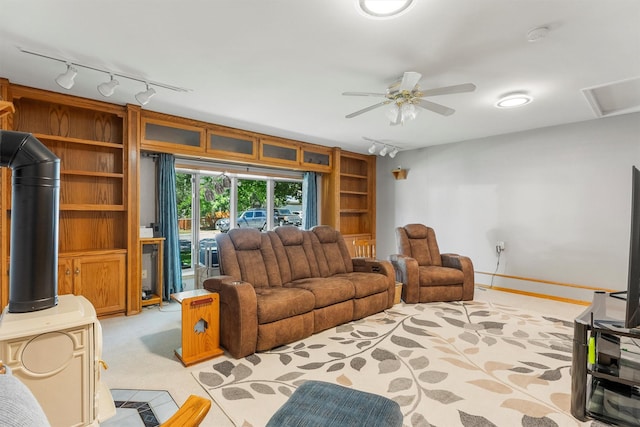 238 Red Fox Rd, Lolo, MT 59847 - living area featuring rail lighting, light colored carpet, and a ceiling fan