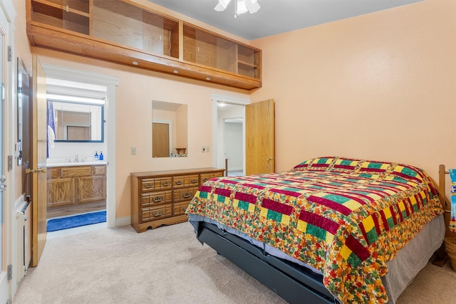 238 Red Fox Rd, Lolo, MT 59847 - bedroom featuring light carpet, a sink, ceiling fan, and ensuite bath