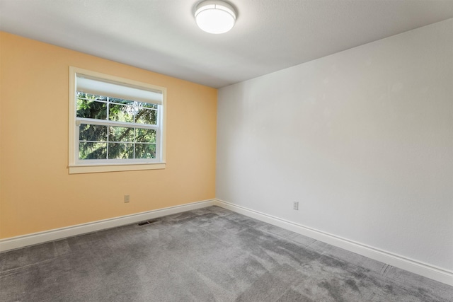 238 Red Fox Rd, Lolo, MT 59847 - spare room featuring baseboards and carpet floors