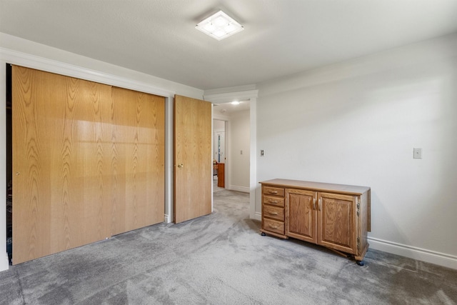 238 Red Fox Rd, Lolo, MT 59847 - unfurnished bedroom with carpet flooring, a closet, and baseboards
