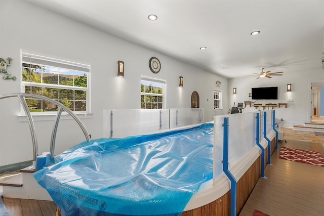 238 Red Fox Rd, Lolo, MT 59847 - miscellaneous room with wood finished floors, ceiling fan, and recessed lighting