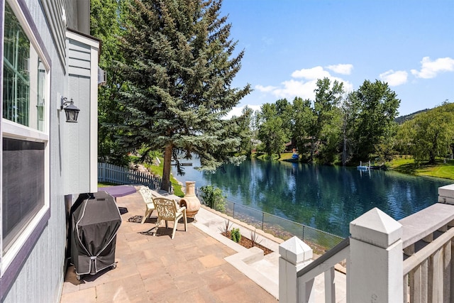238 Red Fox Rd, Lolo, MT 59847 - view of patio with a water view and grilling area