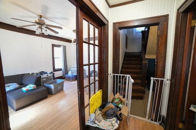 712 9th St N, Great Falls, MT 59401 - hall with wood finished floors, ornamental molding, and stairs