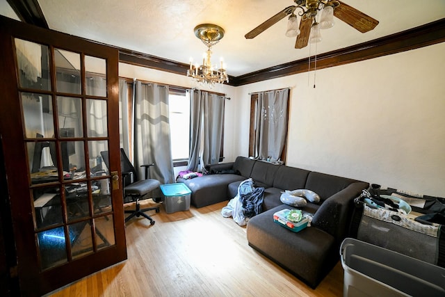 712 9th St N, Great Falls, MT 59401 - living area featuring wood finished floors, a ceiling fan, ornamental molding, and a chandelier