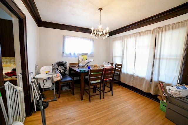 712 9th St N, Great Falls, MT 59401 - dining area featuring a chandelier, light wood-style flooring, and ornamental molding