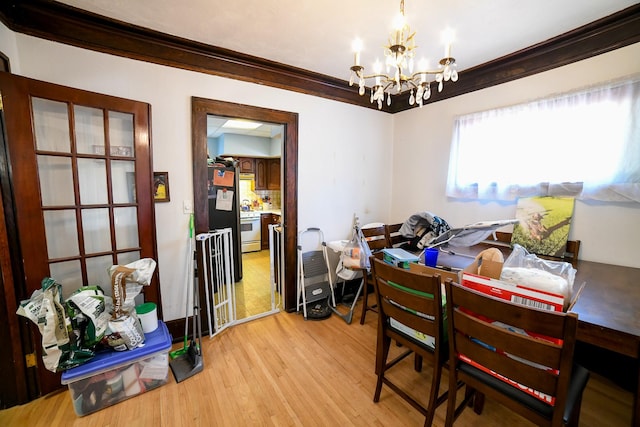 712 9th St N, Great Falls, MT 59401 - dining area featuring a chandelier, light wood finished floors, and ornamental molding