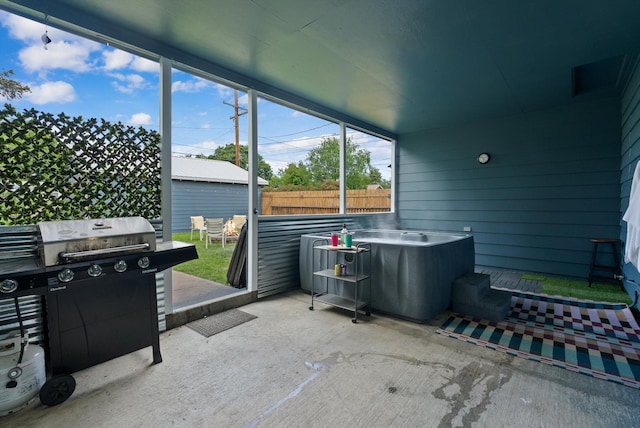 1108 4th Ave W, Columbia Falls, MT 59912 - view of patio featuring a hot tub and area for grilling