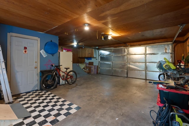 1108 4th Ave W, Columbia Falls, MT 59912 - garage featuring a garage door opener and wood ceiling