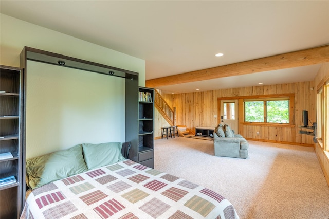 599 Talon Trl, Columbia Falls, MT 59912 - carpeted bedroom featuring wooden walls, beamed ceiling, and recessed lighting