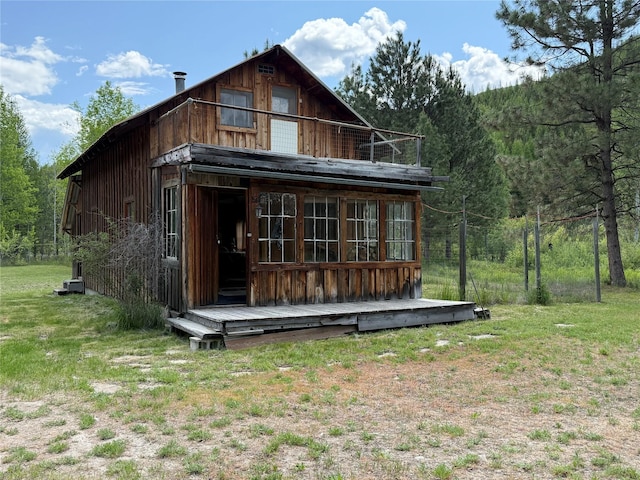63450 US Highway 2, Libby, MT 59923 - back of house with a balcony and a forest view
