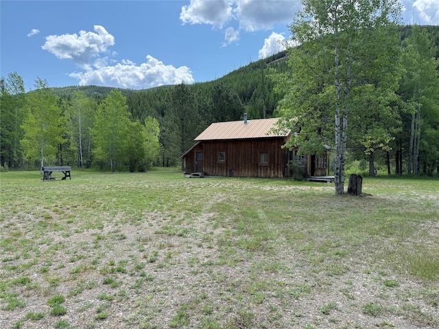 63450 US Highway 2, Libby, MT 59923 - view of grassy yard featuring a view of trees