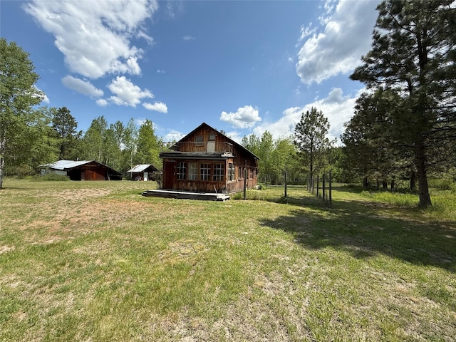 63450 US Highway 2, Libby, MT 59923 - view of green lawn with an outdoor structure and a barn