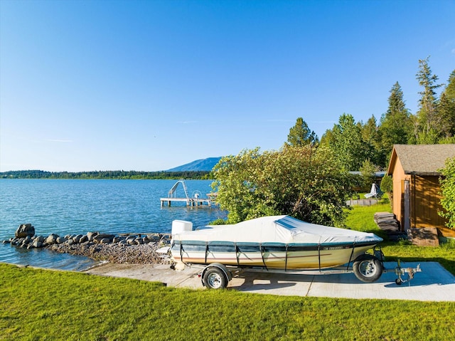 34777 Compass Ln, Polson, MT 59860 - dock featuring a water view and a lawn