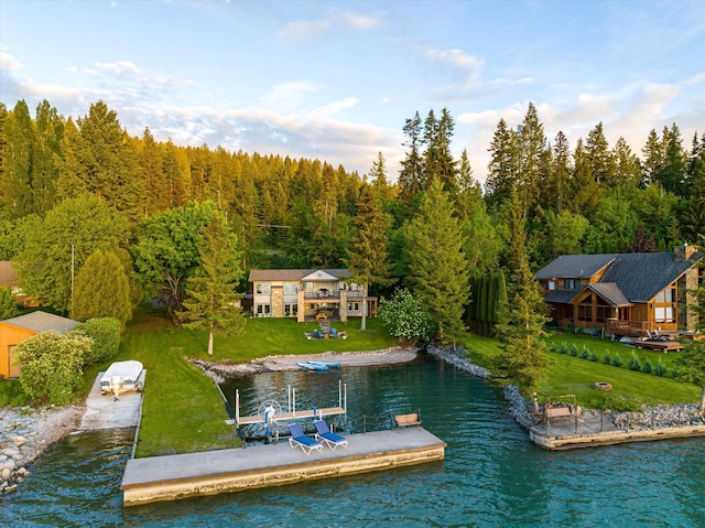 34777 Compass Ln, Polson, MT 59860 - dock area with a water view, a view of trees, and a yard