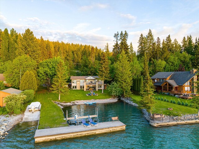 34777 Compass Ln, Polson, MT 59860 - dock area featuring a water view, a yard, and a forest view