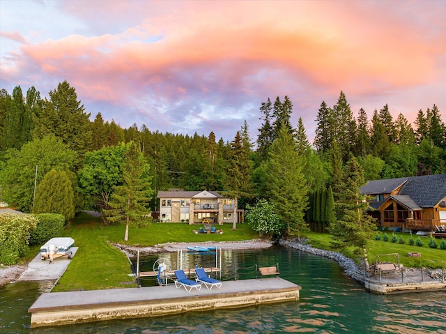 34777 Compass Ln, Polson, MT 59860 - dock with a water view, a wooded view, and a yard