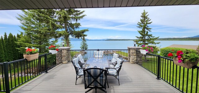 34777 Compass Ln, Polson, MT 59860 - wooden terrace featuring a water view and outdoor dining area