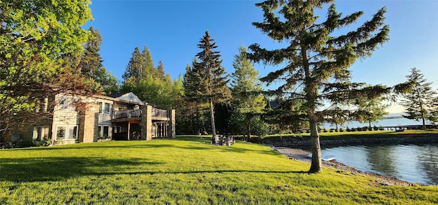 34777 Compass Ln, Polson, MT 59860 - view of green lawn featuring a deck with water view
